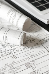 sustainable architecture tools and materials: blueprints, solar panel, wood textures, fabric...