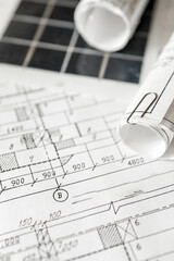 sustainable architecture tools and materials: blueprints, solar panel, wood textures, fabric...