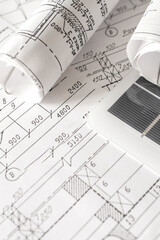 sustainable architecture tools and materials: blueprints, solar panel, wood textures, fabric...