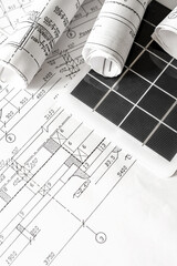 sustainable architecture tools and materials: blueprints, solar panel, wood textures, fabric...