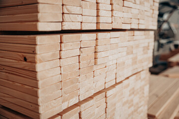 Neatly Stacked Wooden Planks in Workshop Storage