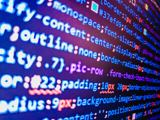 Focus point on the decrypted word. Blue background color, white text chars and digits. Concept for cyber security. Internet concept, javascript code. React HTML, native concept on LCD