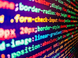 Programmer working in a software develop company office. Desktop PC monitor photo. The flow of...