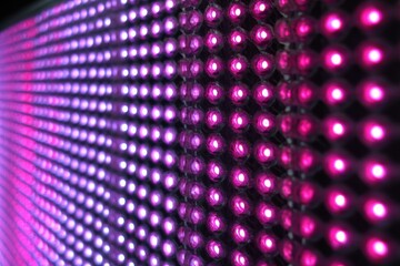 Obraz premium Close-up of a Bright LED Display Panel Showing Pink Color, Offering Vibrant Visuals and Modern Technology
