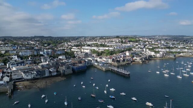 Falmouth, Cornwall, England: DRONE VIEWS: The town of Falmouth and the St Mawes ferry quay with moored yachts on the River Fal. Falmouth is a popular UK holiday destination and port town (Clip 2).