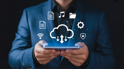 Businessman holding a smartphone displaying a glowing cloud computing interface with various digital icons and data transfer symbols