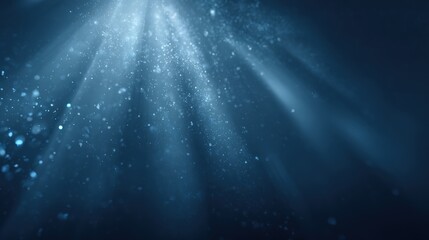 Underwater Light Rays Illuminate Deep Blue Sea, Creating Ethereal and Dreamlike Aquatic Scene