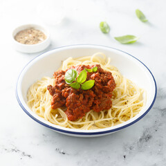 Traditional spaghetti Bolognese with fresh basil