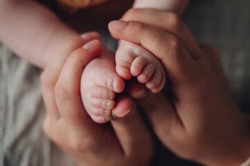 Tender Moments with a Newborn's Tiny Feet