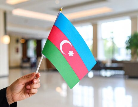  Hand Holding the National Flag of Azerbaijan