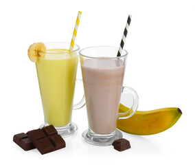 Different tasty milkshakes in glasses and ingredients isolated on white
