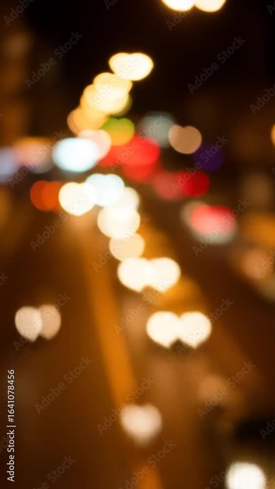 Aufkleber blurred cityscape at night with bokeh lights featuring traffic on roadways creating abstract visual 