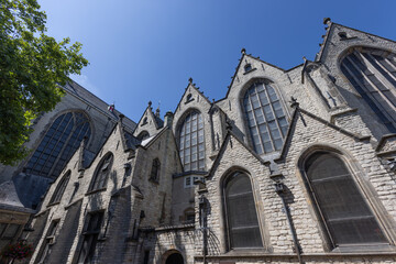 The intricate and grand architecture of Sint Janskerk church in Gouda, featuring detailed stone...
