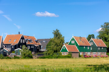 A small town village of Marken in summer, Architecture traditional houses and church under blue sky...