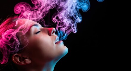 Closeup profile of a woman exhaling colorful pink and blue smoke, creating an ethereal and vibrant atmosphere against a dark background