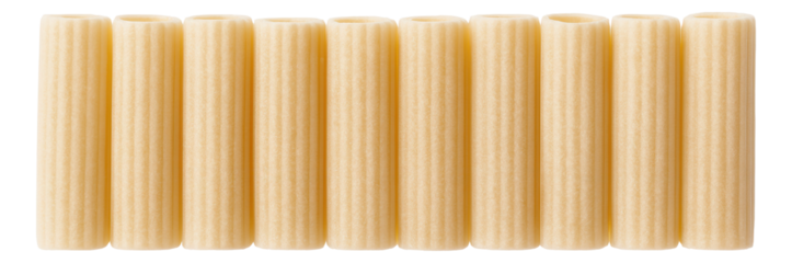 Nine uncooked side-by-side cannelloni pasta tubes with a ridged texture.