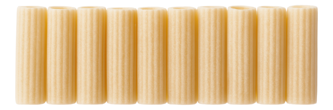 Nine uncooked side-by-side cannelloni pasta tubes with a ridged texture.
