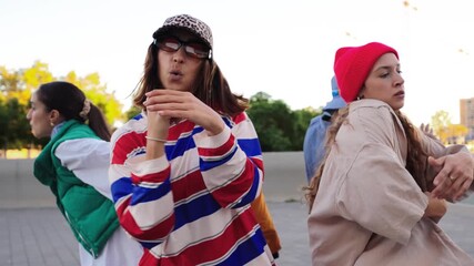 A dynamic group of friends showcasing their energetic dance moves, filled with joy and enthusiasm, creating an infectious vibe while enjoying their time together in a spirited celebration of movement. - Powered by Adobe