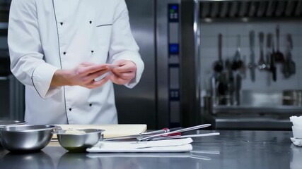Chef preparing dough in a professional kitchen