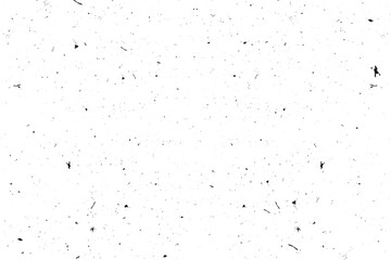 Abstract texture with scattered black particles on a white background.
