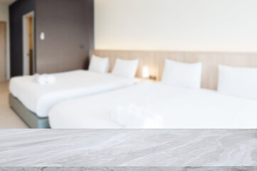 Marble tabletop with blurred hotel bedroom background