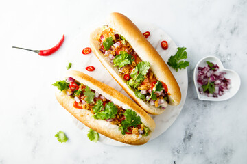 Hot dogs with red pepper and cilantro