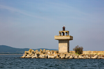 Old concrete light house in the bay of Sozoppol