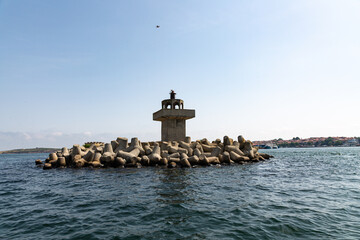 Old concrete light house in the bay of Sozoppol