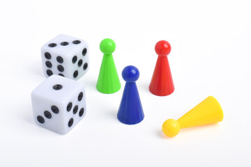 Playing pieces and dice isolated on white background