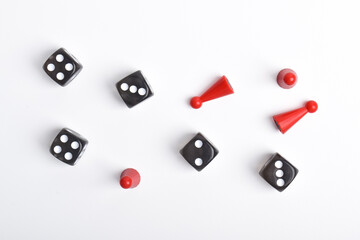 Board game figures and dice isolated on white background