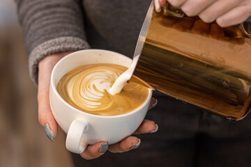 Barista coffee service concept.Barista women using coffee machine to make coffee in cafe