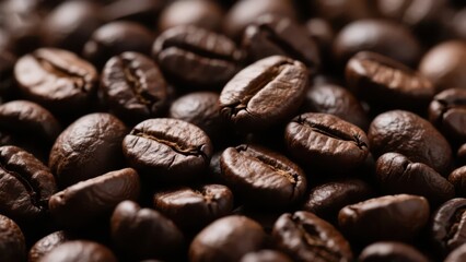 Fototapeta premium A close - up shows roasted coffee beans, plump and round with a deep brown color, presenting the rich texture of coffee raw materials.
