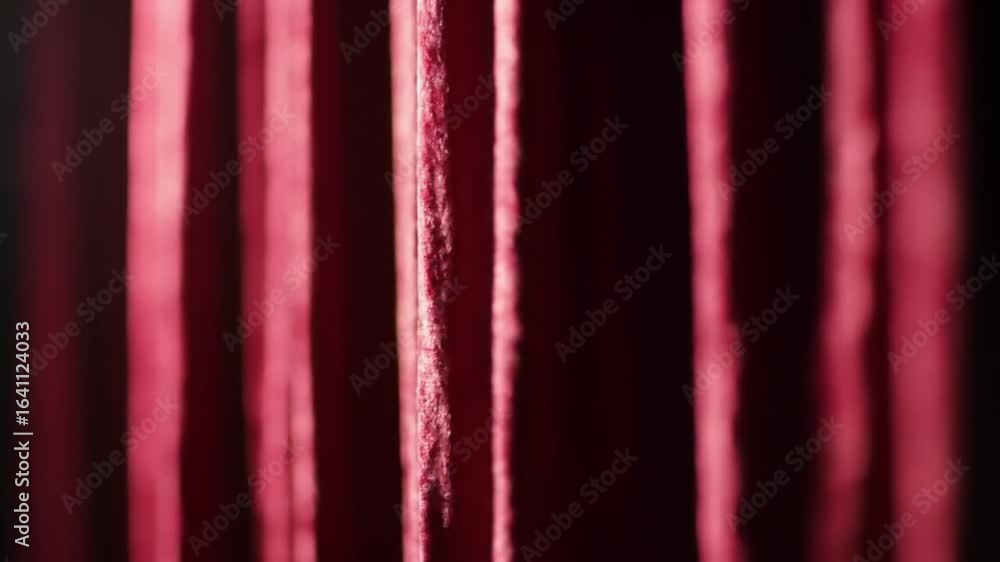 Poster Dynamic red threads sway gently against dark background, creating abstract visual flow.