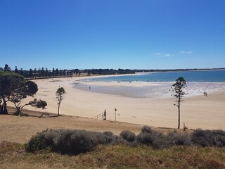 Coastal Beach with Golden Sand and Blue Waters