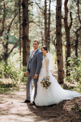portrait of an elegant groom in a blue suit