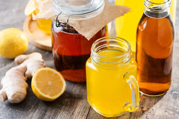 Colorful Kombucha Jars and Bottles on wooden table	