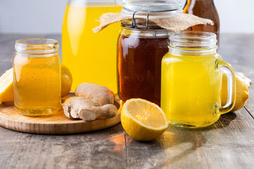 Colorful Kombucha Jars and Bottles on wooden table	