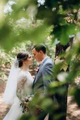 portrait of an elegant groom in a blue suit