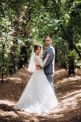 portrait of an elegant groom in a blue suit