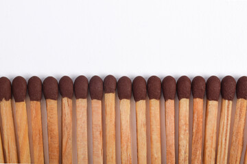 Wooden match isolated on white background, space fo text