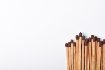 Wooden match isolated on white background, space fo text