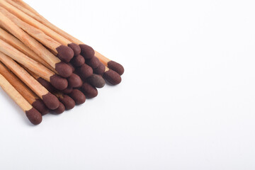 Wooden match isolated on white background, space fo text