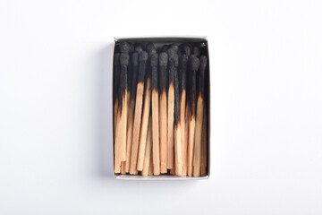 Burning matches in the matchbox isolated on white background. Box of matches.