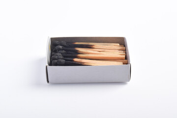 Burning matches in the matchbox isolated on white background. Box of matches.