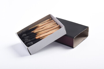 Burning matches in the matchbox isolated on white background. Box of matches.