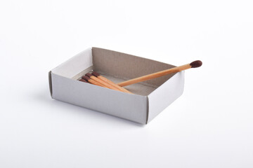 Box of matches isolated on white background, for ignition, safety, and household concept.