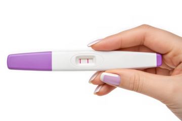 Hand holding positive pregnancy test showing two lines