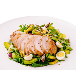 Grilled chicken salad with fresh vegetables and hard-boiled eggs