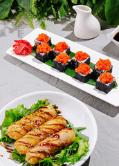 Delicious sushi and rolls served on elegant plates for a gourmet experience