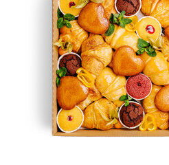 Delicious assortment of pastries and desserts in a dessert box